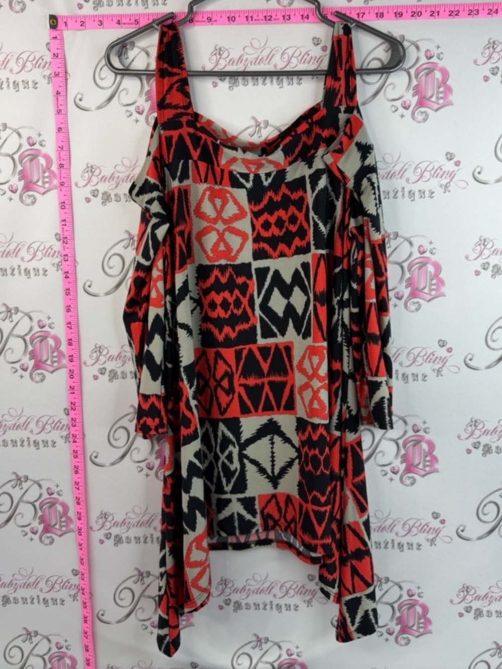 Come and see Plus Cold-Shoulder Geometric Tunic in Red and Cream cozy and casual